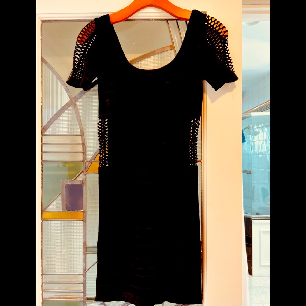 bebe Black stretch Dress.  Sleek and Sexy.  Machine washable.  Only worn once.